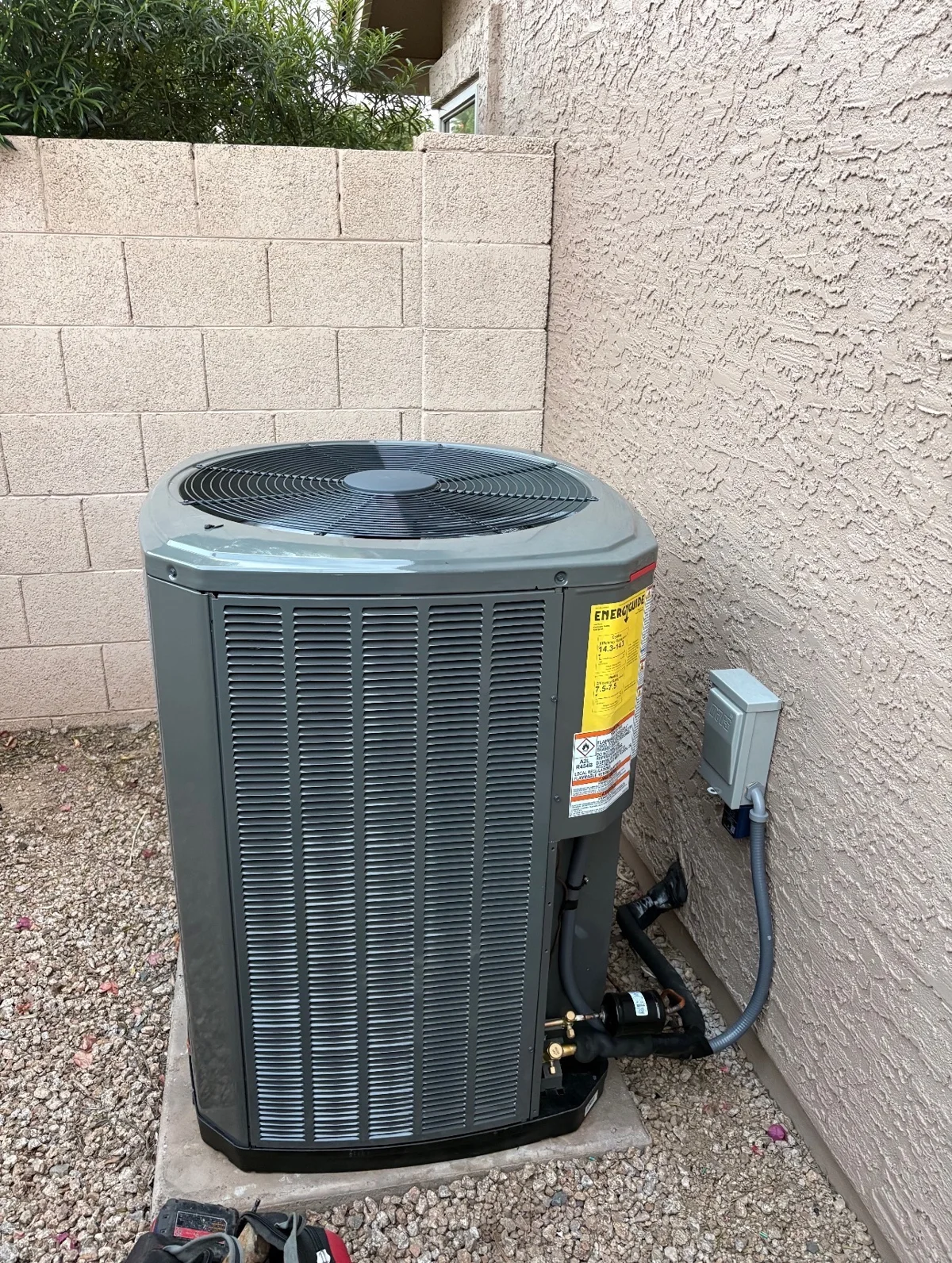 Outdoor cooling equipment beside a home.